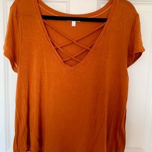 Orange Crisscrossed Neckline Short Sleeve Shirt. Very flowy and lightweight.